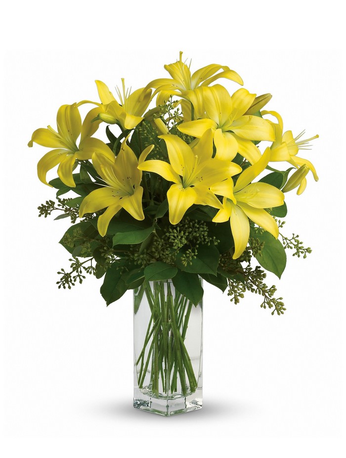 Yellow lilies in a glass vase