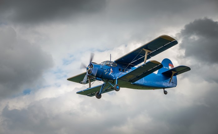 Blue Antonov An-2 Biplane in Flight