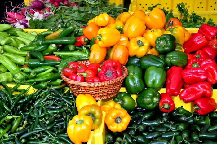 Many Bell Peppers and Chili Peppers at a Market