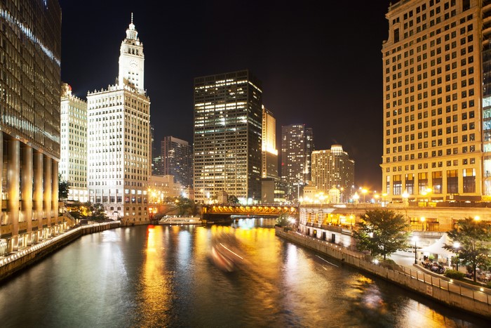 Chicago River at night with buildings and bridge