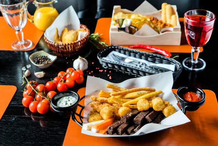 Appetizer platter with fries, croutons, and dips