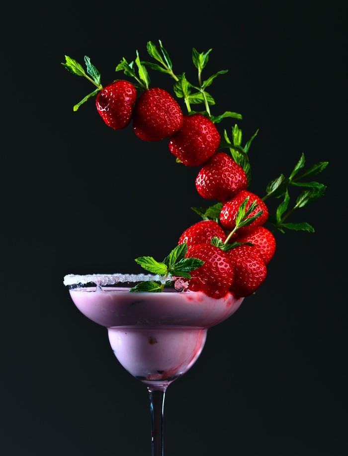Strawberry cocktail with mint and sugar rim