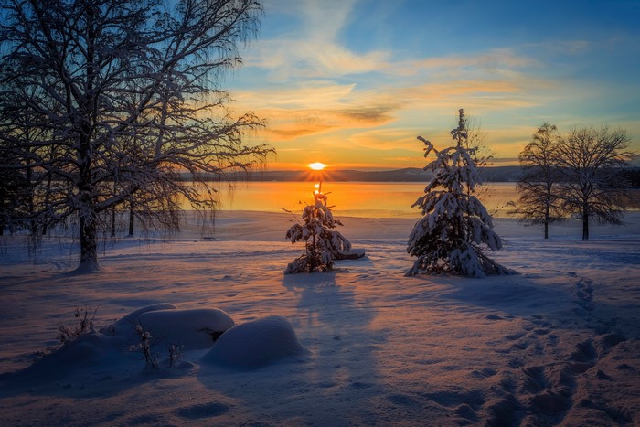 Winter sunset over a snowy landscape in Arvika, Sweden