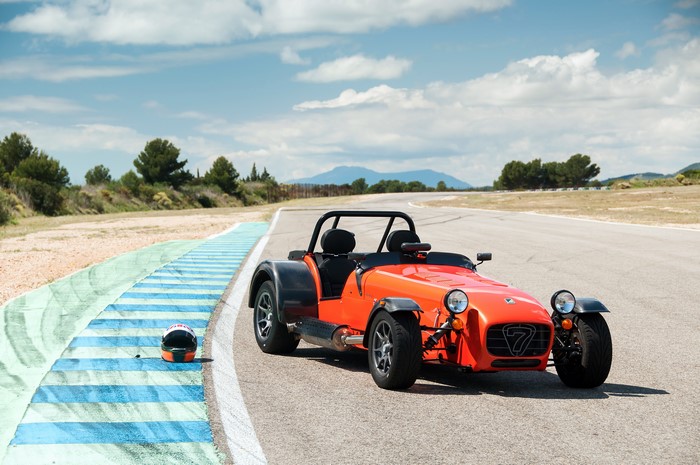 Orange Caterham 7 on a Race Track