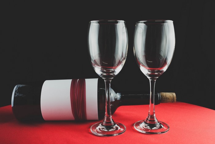 Two wine glasses and a bottle of wine