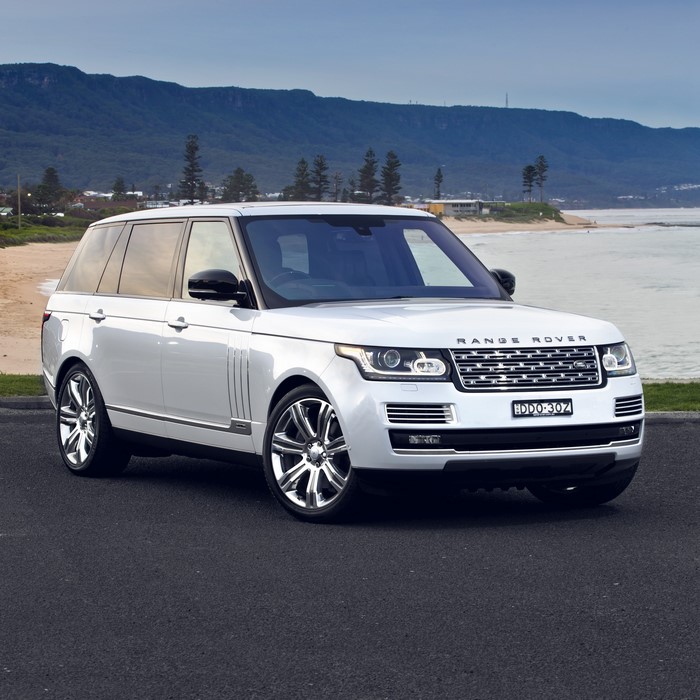 White Range Rover Vogue on a Coastal Road