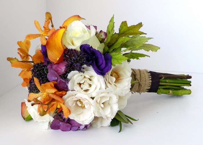 Bouquet with white roses, orange orchids, and purple flowers