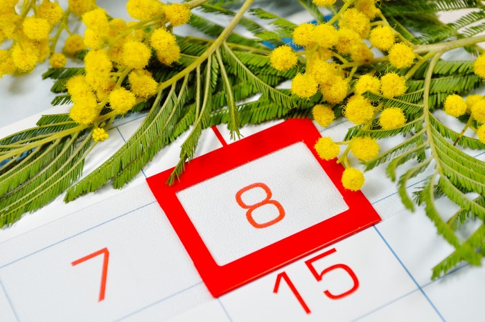 March 8th on Calendar with Mimosa Flowers