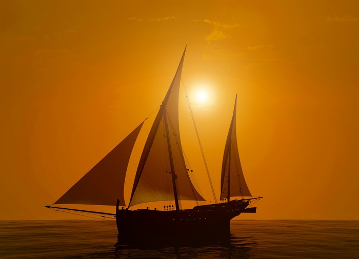Sailboat on the sea at sunset