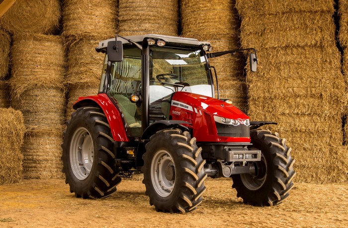 Massey Ferguson 5609 tractor in a barn with hay bales