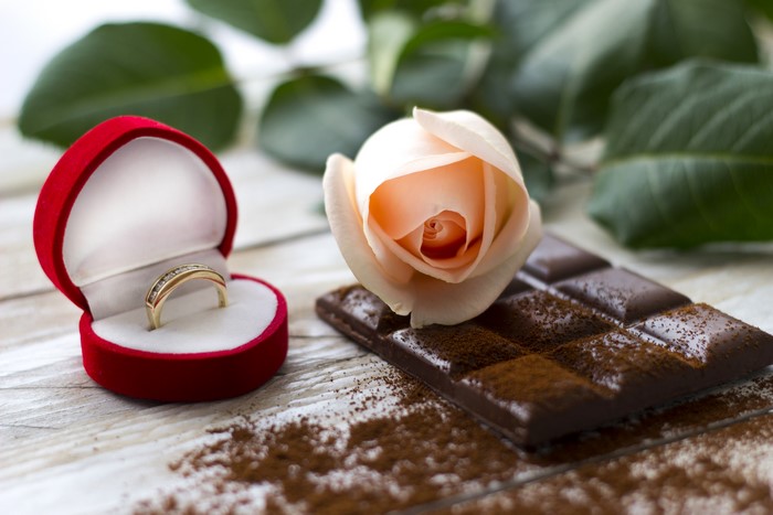 Ring in box with rose and chocolate