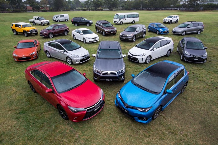 Collection of Toyota Cars on a Grassy Field