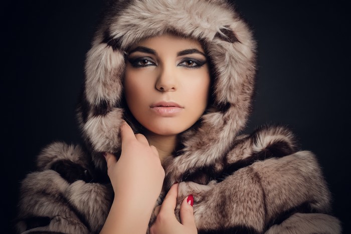 Woman in Fur Coat with Hood