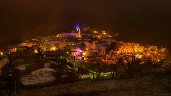 Night view of Greolieres, France with snow