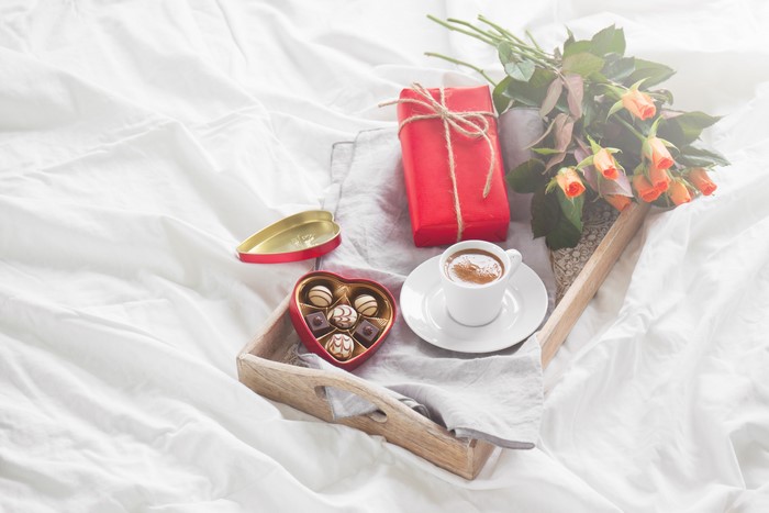 Valentine's Day breakfast in bed with coffee and chocolates