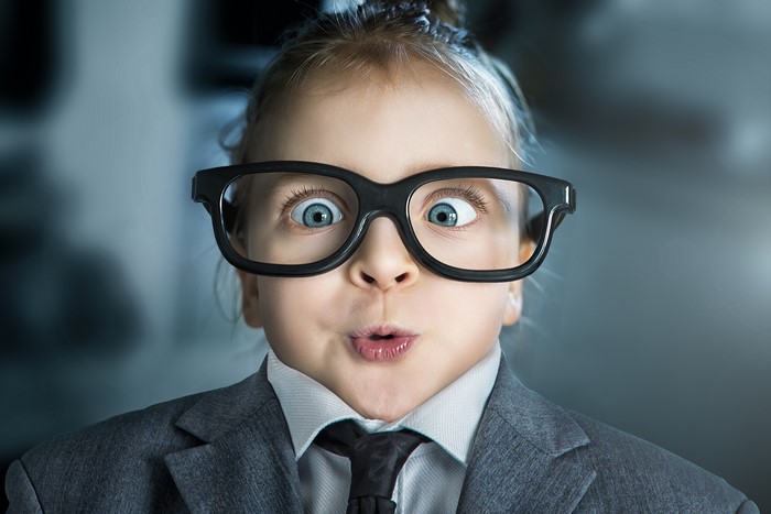Girl in Suit and Glasses with Cross-Eyed Expression