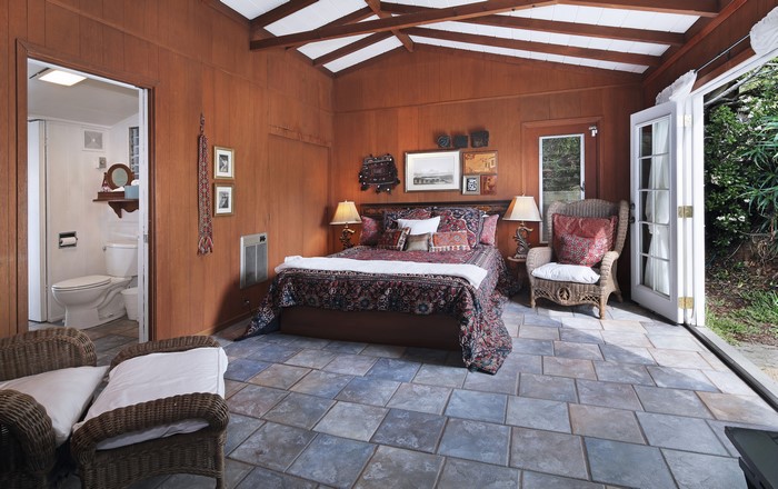 Bedroom with ensuite bathroom and patio doors