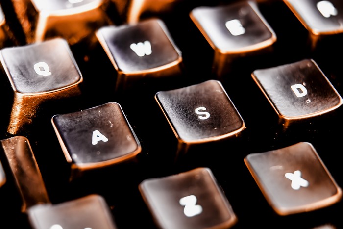 Macro closeup of a retro keyboard with orange lighting
