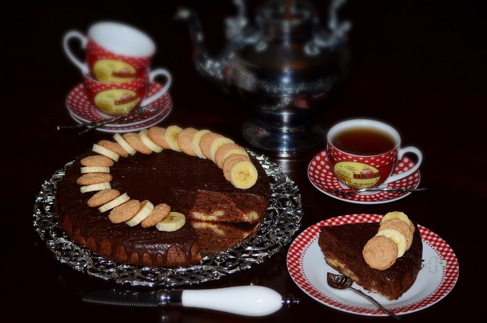 Chocolate cake with tea and cookies