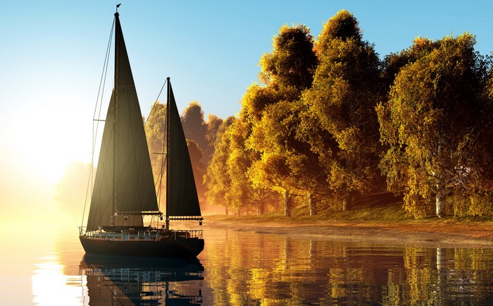 Sailboat on a lake with autumn trees