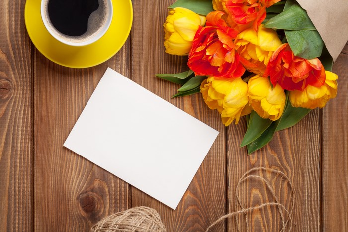 Tulips, Coffee, and Greeting Card on Wood