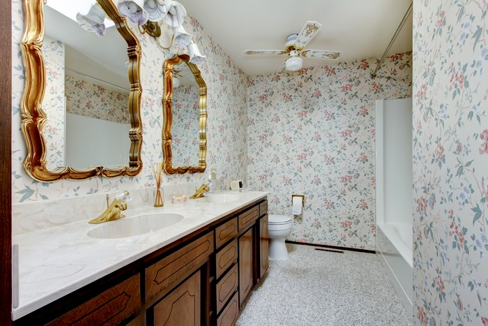 Bathroom with floral wallpaper and double vanity