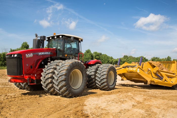 Red Versatile 550SS Tractor with Scraper