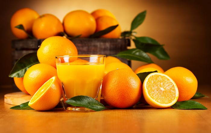 Oranges and orange juice in a glass