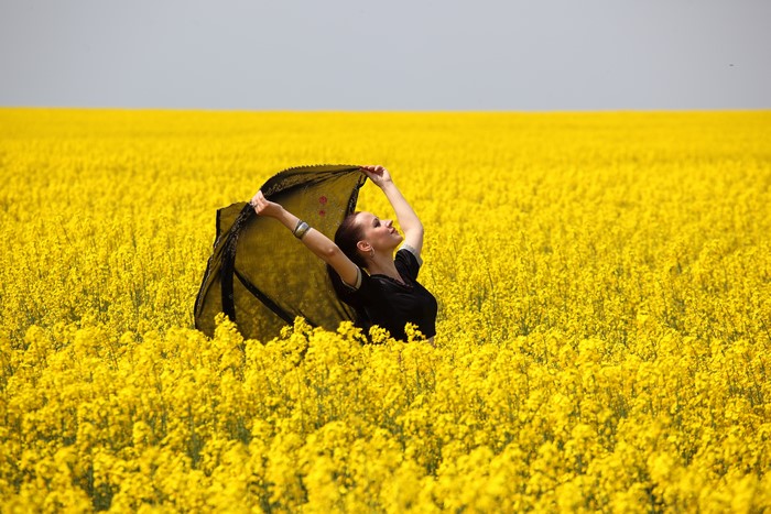 Woman in a rapeseed field