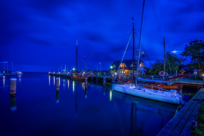 Boats in a marina at night in Ahrenshoop, Germany