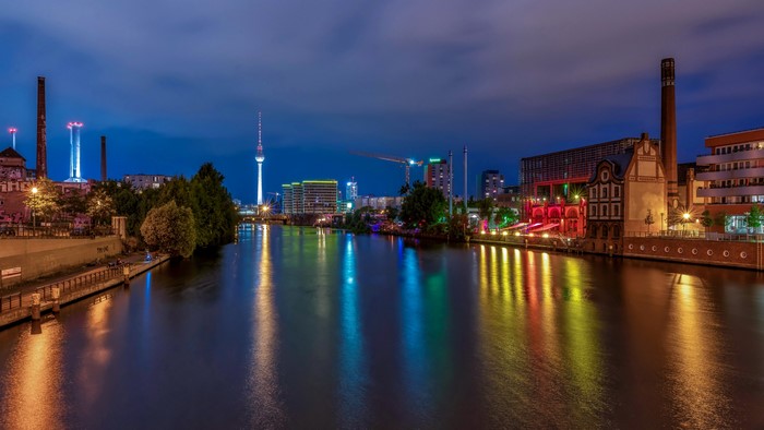 Berlin skyline with river at night