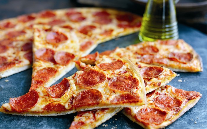 Pepperoni Pizza Slices on a Dark Surface