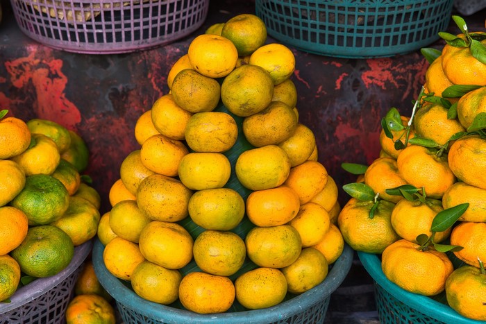 Oranges in baskets at a market