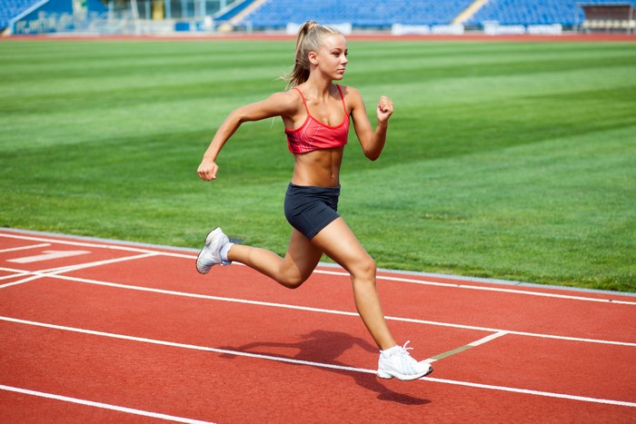 4K Blonde Girl Running on Track
