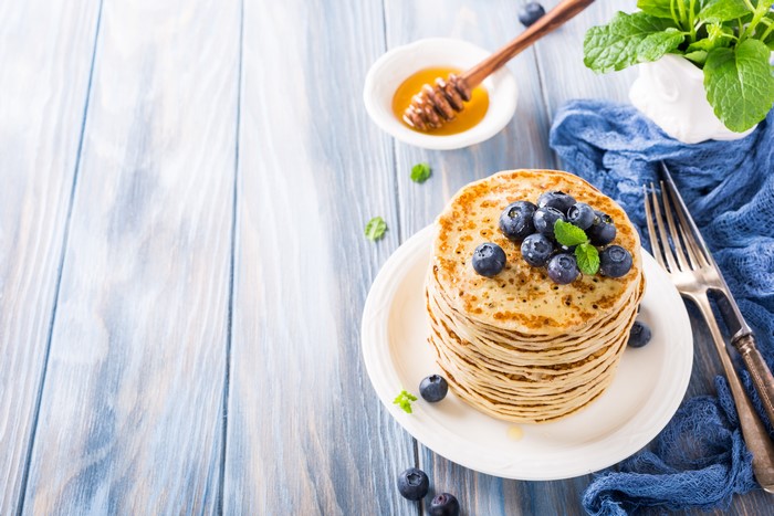 Stack of Pancakes with Blueberries and Honey