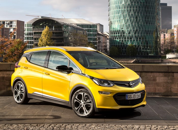 Yellow 2016 Opel Ampera-e parked in a city