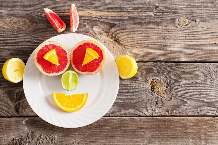 Fruit smiley face on wood planks