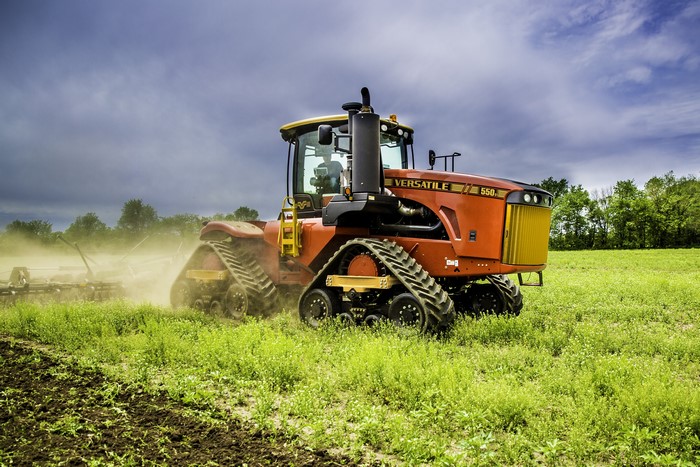 Versatile 550DT tractor plowing a field