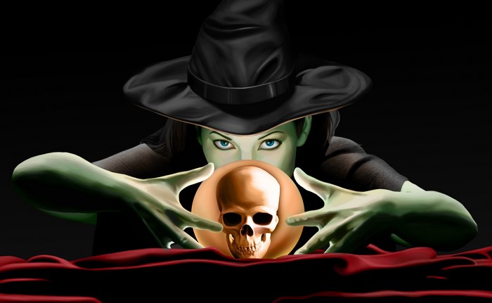 Witch with a crystal ball and skull