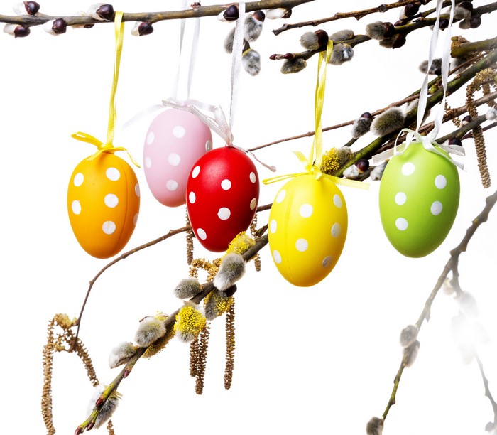 Easter eggs hanging on branches