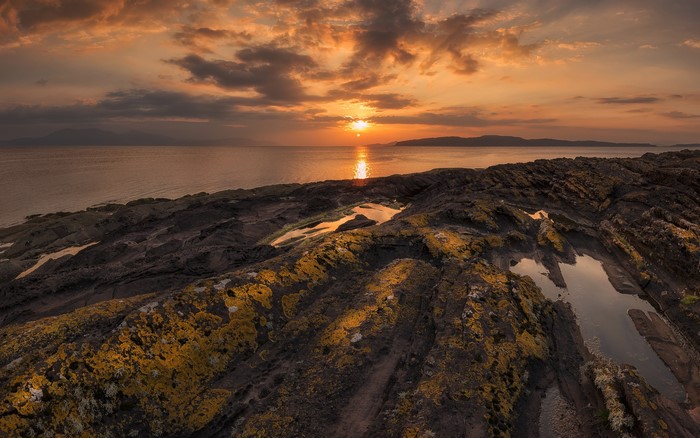 Sunset over the rocky coast of North Ayrshire, Scotland