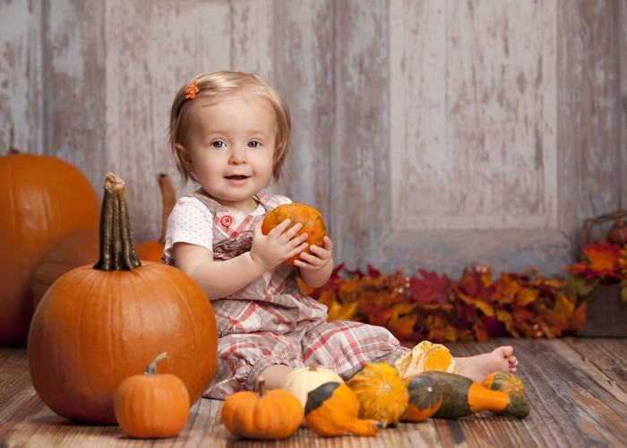 Baby Girl with Pumpkins
