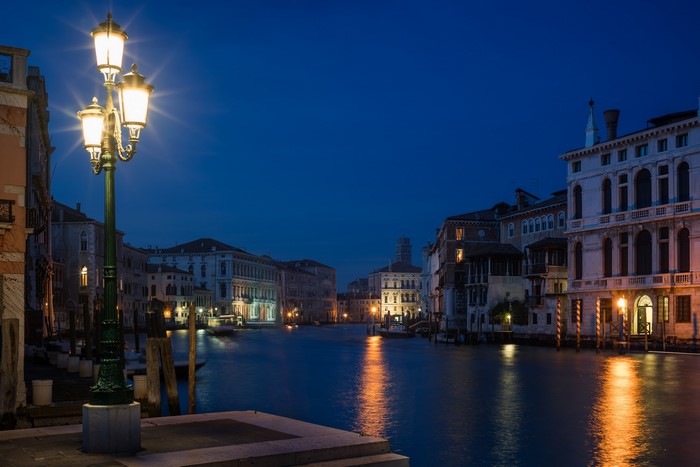 Venice canal at night with street lights