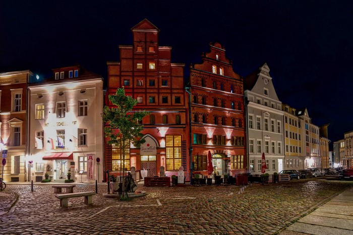 Street at night in Stralsund, Germany with historic houses and cobblestone street