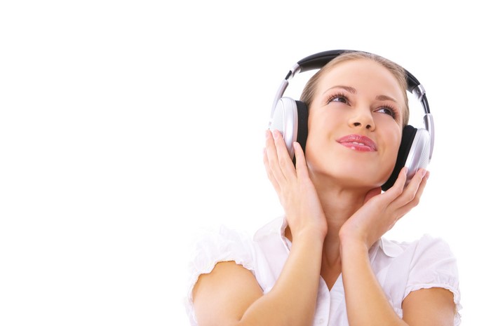 Woman wearing headphones and smiling