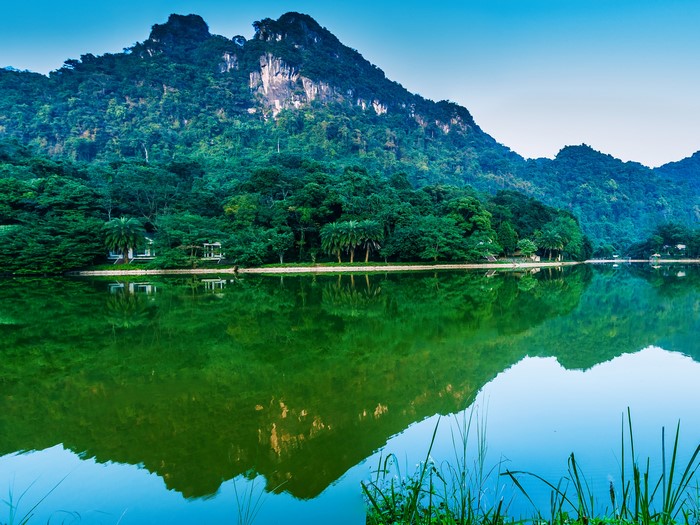 Mountains reflected in a lake in Vietnam