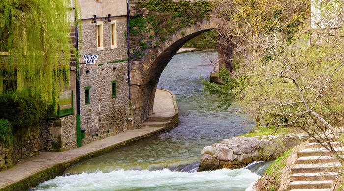 Stone bridge over a river in Potes, Cantabria, Spain