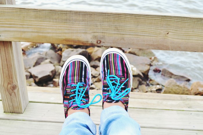 Colorful striped plimsoll shoes with blue laces