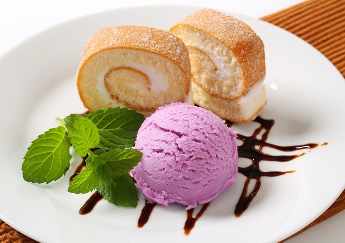 Swiss roll cake with ice cream and mint