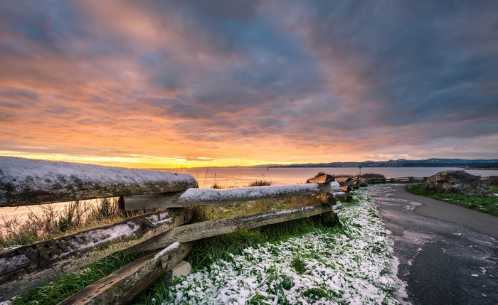 Snowy fence along the coast at sunrise in British Columbia, Canada
